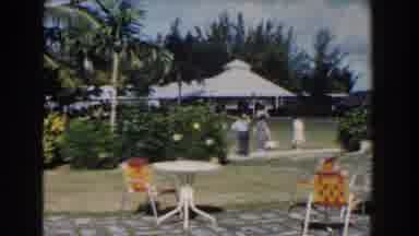 Nassau Bahamas (1961): Two Elderly Women And An Overweight Man Walk On A Sidewalk