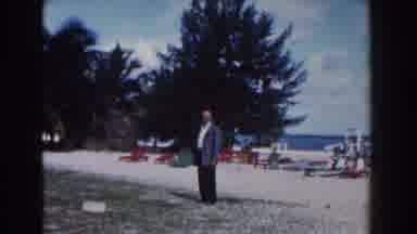 Nassau Bahamas (1961): Man Wearing A Suit On The Beach Walking Towards The