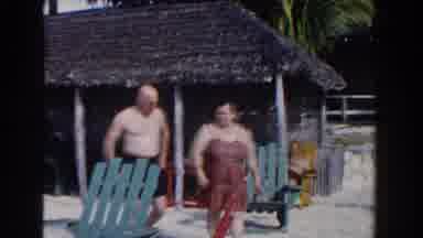 Nassau Bahamas (1961): A Man And Woman Walking On A Beach Towards The Camera