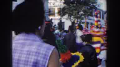 Nassau Bahamas (1961): People Gathered On A Parade And Jokers And They Are Walking
