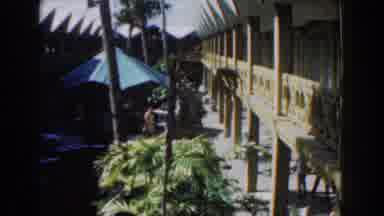 Nassau Bahamas-1961: People Roaming Inside A Two-Storey Building With An Open Roof