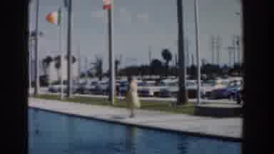 Nassau Bahamas (1961): A Woman Walking Alone By The Side Of A Fountain In Daytime
