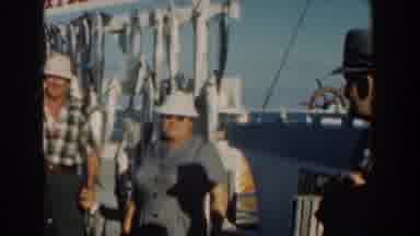 Nassau Bahamas (1961): Three People Talking In An Industry Dressed In Hard Hats