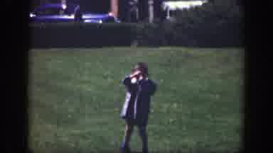 Cincinnatti Ohio (1949): A Child Walking In A Field Of Grass Blocking The Sun From