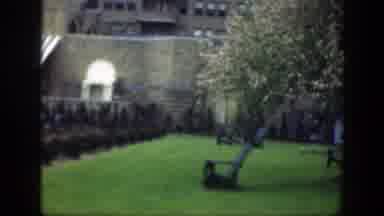 Cincinnatti Ohio (1949): View Of Tan Building With Green Grass And Woman Wearing