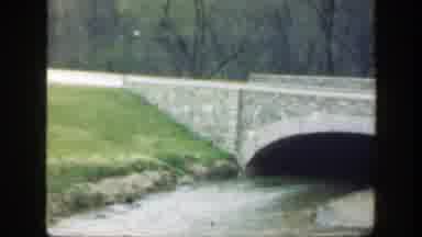 Cincinnatti Ohio (1949): A Boy Views The Stream Flowing Under A Bridge With A