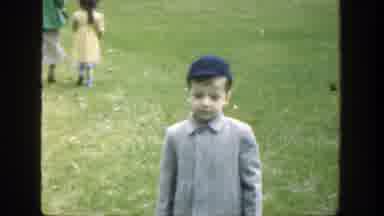 Cincinnatti Ohio (1949): Boy Wearing Blue Hat Puts Hands On Hips And Blinks Eyes