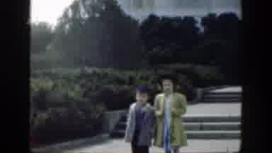 Cincinnatti Ohio (1949): Two Children Walking In A Park With Many Bushes On The
