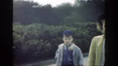 Cincinnatti Ohio (1949): Woman Walking Along With Her Son As His Brother Runs