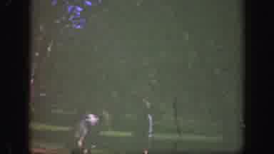 Cincinnatti Ohio (1949): Two Children Play In The Garden In Their Coats In The