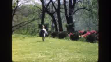 Cincinnatti Ohio (1949): A Child Running On An Elevated Area With Flowers And