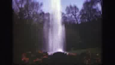 Cincinnatti Ohio-1949: View Of Water Fountain And Red Flowers On A Sunny Day