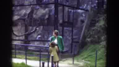 Cincinnatti Ohio (1949): Woman Wearing Green Jacket Walks With Girl Wearing Yellow