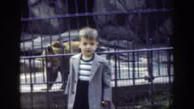 Cincinnatti Ohio (1949): A Little Kid Is Posing For The Camera In Front Of A Bear