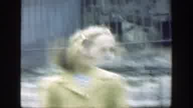 Cincinnatti Ohio (1949): Woman And Small Boy Walk Away From Gray Iron Cages In A