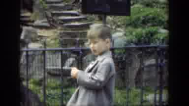 Cincinnatti Ohio (1949): A Little Boy At A Park Wearing A Suit And Smiling To The