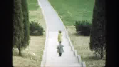 Cincinnatti Ohio (1949): A Person In A Gray Jacket Running After A Person In A