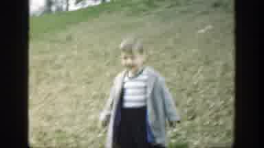 Cincinnatti Ohio (1949): A Boy Running On The Grass With A Big Smile And Him And