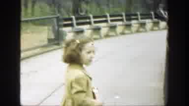 Cincinnatti Ohio (1949): Little Girl And Boy Eating Popcorn Standing By Fence In A