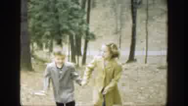 Cincinnatti Ohio (1949): A Boy And A Girl Holding Hands Walking Up A Hill Outside