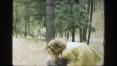 Cincinnatti Ohio (1949): Girl Wearing Yellow Coat Walks With Boy Wearing Gray Coat
