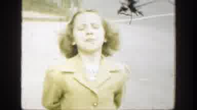 Cincinnatti Ohio (1949): Boy Wearing Tan Coat Runs Behind Girl Down Street On A