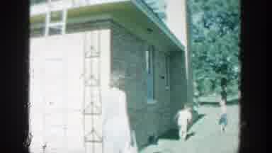 Wisconsin (1964): A Kid With A Big Bike And A Mother With Two Kids Playing By A