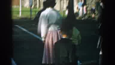 Wisconsin (1964): A Little Boy Wearing A Suit And Running To Take Her Mother Hand