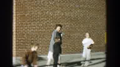 Wisconsin (1964): A Lady Walking With A Kid On Her Hand With A Lot Of Children