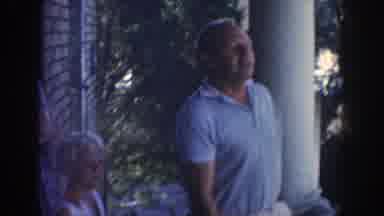 Wisconsin (1964): Woman Wearing Blue Dress And Glasses Reads Orange Folder On A