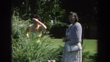Wisconsin (1964): Confused Looking Lady In An Apron Standing With Another Lady