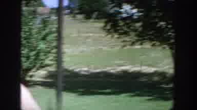 Wisconsin (1964): A Woman In Swimming Pants Listens To Some Visitors And Walks