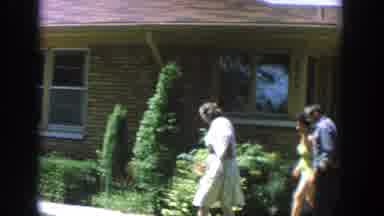 Wisconsin (1964): Two Ladies And A Man Walking To A Front Porch Where The Two