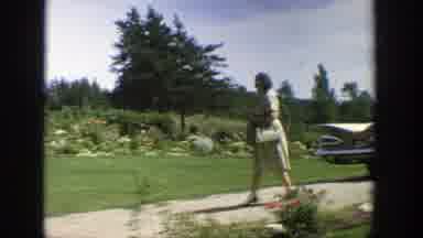 Wisconsin (1964): Person Working In The Yard Outside Picking Up Paper