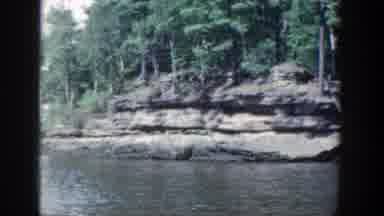 Wisconsin (1964): Boat Ride On The Water With Lots Of Trees And Rocks Around And