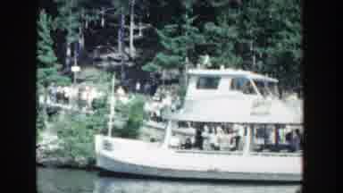 Wisconsin (1964): Boat People Walking Forest Sky Water Green Trees Clouds Bridge
