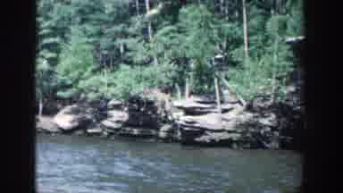Wisconsin (1964): A River Surrounded By Rocks And Trees From Two Different