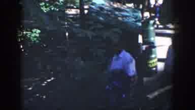 Wisconsin (1964): People Moving Along A Path And Images Looking Up On A Large