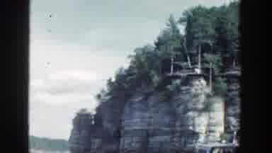 Wisconsin (1964): Video Of View Of Small Island Of Rock With Trees On The Sea A