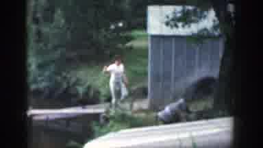 Wisconsin (1964): One Lady Is Walking With A Fishing Rod In The Daytime