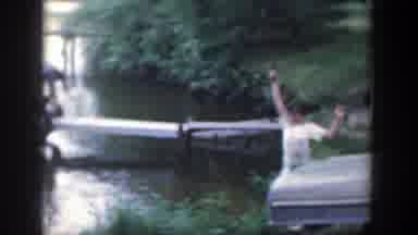 Wisconsin (1964): Children Playing Together Near A Lake With Pieces Of Wood