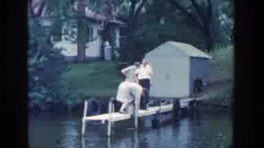 Wisconsin (1964): A Family On A Little Dock Over A River And A Little Girl Smiling