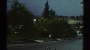 Woodland Hills California (1969): Driving Down A Hill On A Street Lined With Green