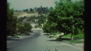 Woodland Hills California (1969): Approaching View Of Green Trees And Two Parked