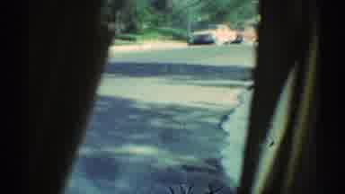 Woodland Hills California (1969): A Car Driving Down The Street Video Taping Other