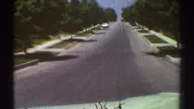 Woodland Hills California-1969: Car Driving Down Tree-Lined Street