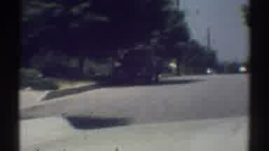 Woodland Hills California (1969): A Driver Drives On And Sees Another Car Parked