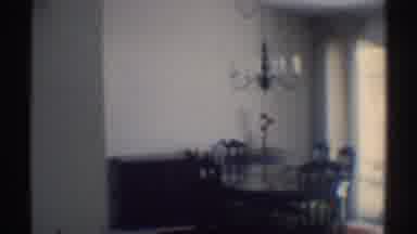 Woodland Hills California (1969): View Of Brown Wooden Dinette Set And Person On