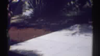Woodland Hills California (1969): A Group Of People Near A Cement Area Talking In