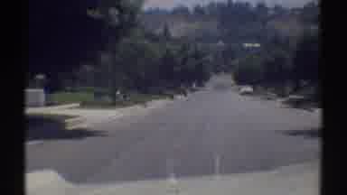 Woodland Hills California (1969): Approaching View Of White Car Parked On Street
